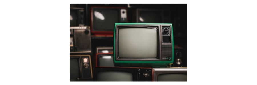 Decorative image showing lots of old televisions stacked on each other. This image is used to represent the topic of the blog: The History of DRTV & How It Has Evolved.